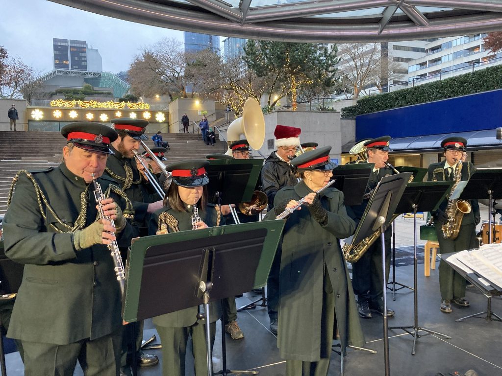 The Band performs holiday music at the UBC Robson Square ice rink in Downtown Vancouver